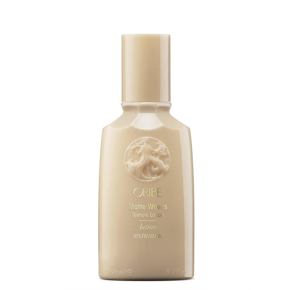 Oribe Matte Waves Texture Lotion bottle for creating beachy waves and matte finish texture in hair.