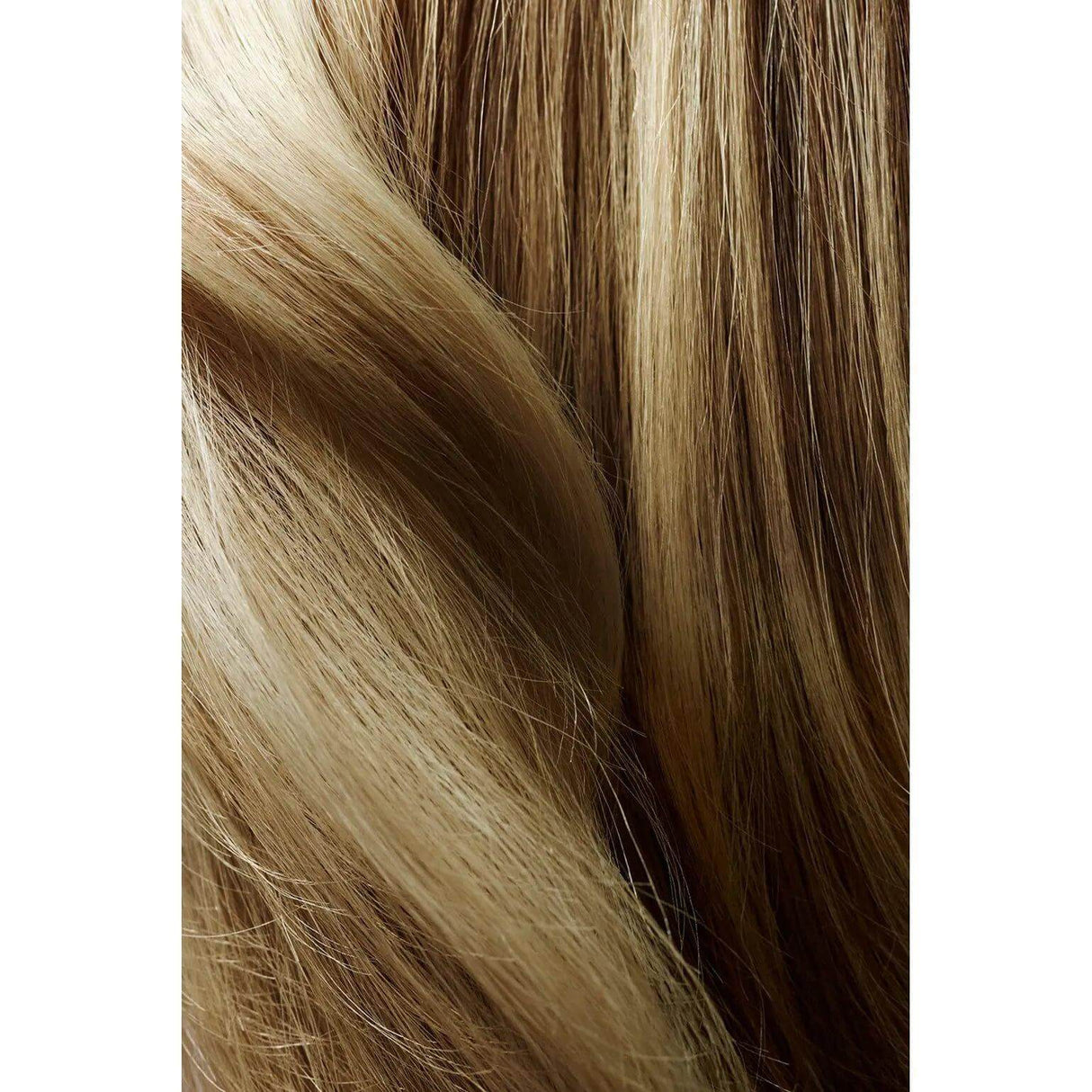 Close-up of sleek, healthy blonde hair showcasing smooth texture and shine.