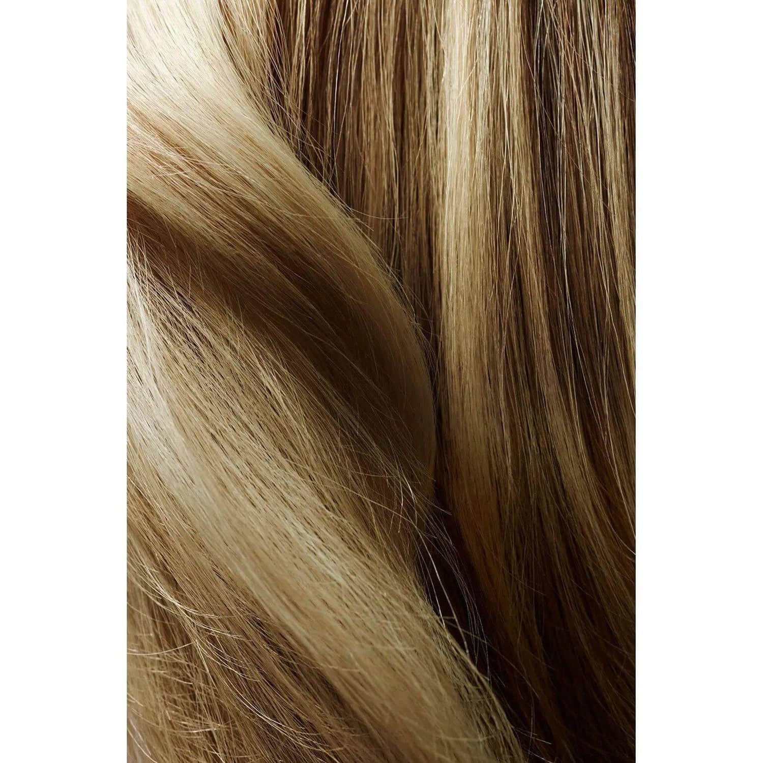 Close-up of sleek, healthy blonde hair showcasing smooth texture and shine.