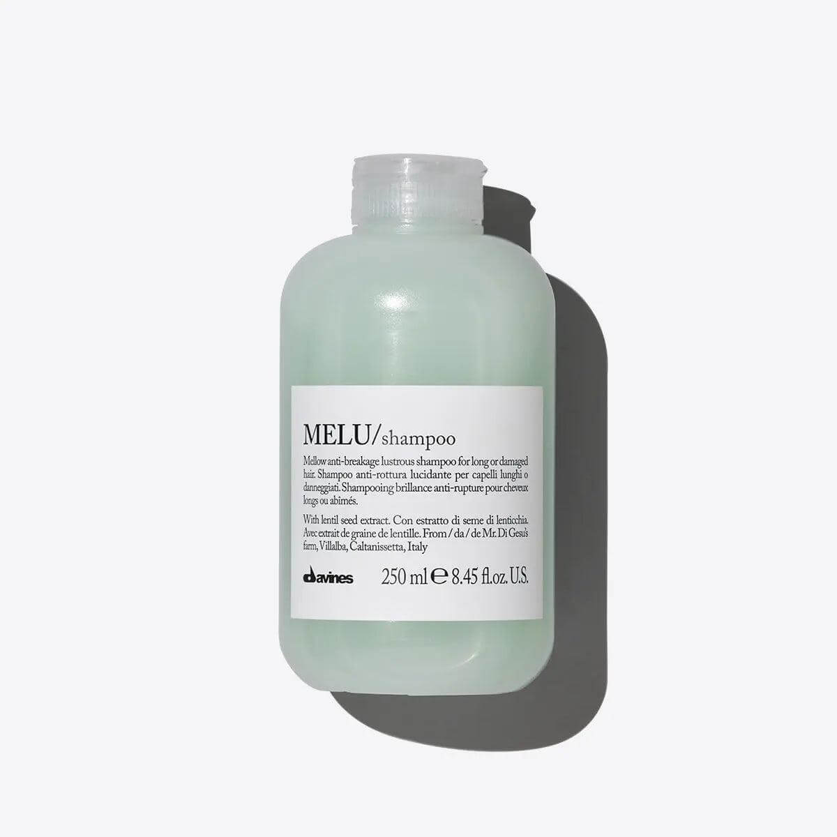 Melu Shampoo bottle, 250 ml, designed to enhance shine and prevent breakage for long or damaged hair with a creamy, gentle cleansing formula.