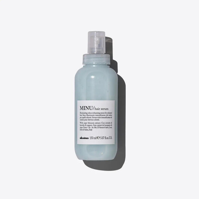Minu Hair Serum bottle, moisturizing leave-on formula for colored hair, enhances shine and color longevity.