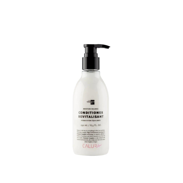 Moisture Balance Conditioner bottle with pump dispenser, vegan, paraben and sulfate-free formula for balanced and hydrated hair.