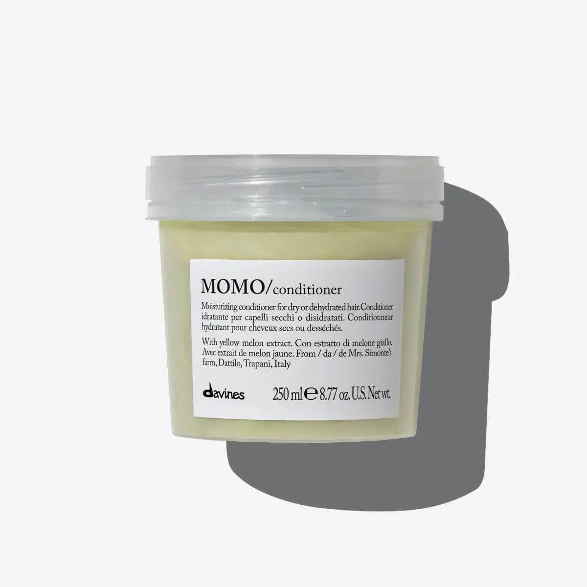 Momo Conditioner jar, a moisturizing product for dry or dehydrated hair, offers hydration and detangling for soft, silky results.