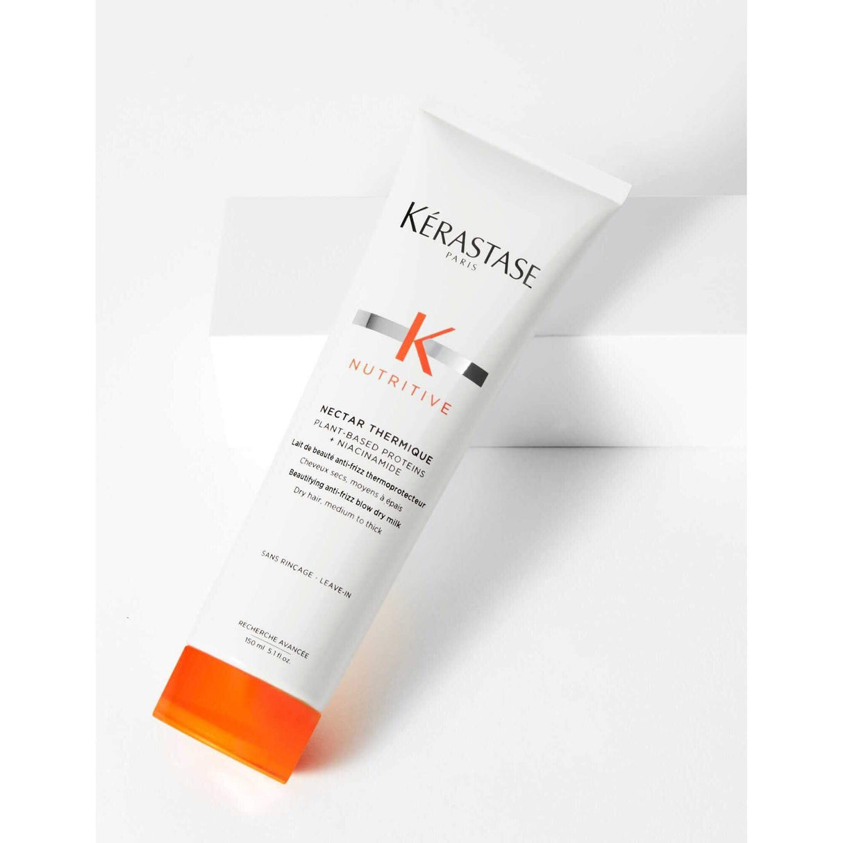 Kérastase Nectar Thermique blow-dry milk for frizz control, heat protection, and nourishment for medium to thick dry hair.
