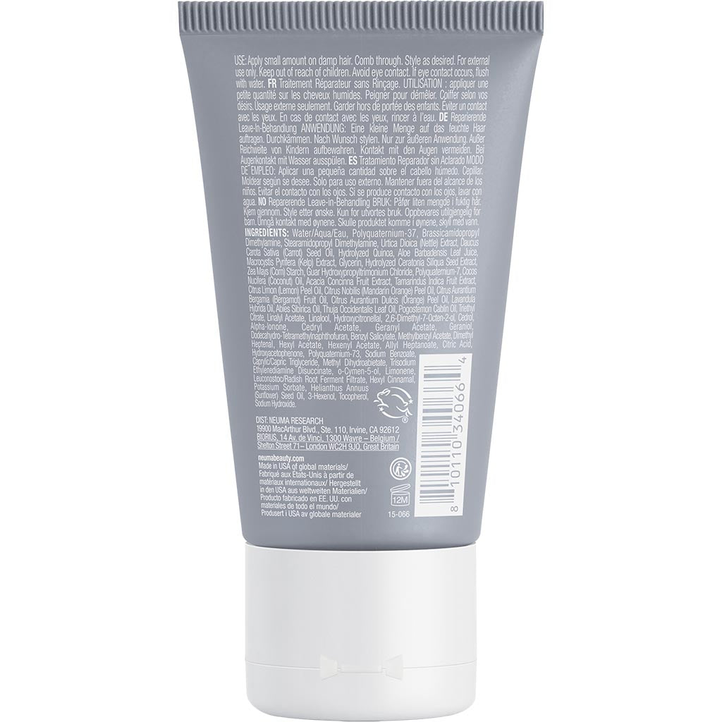 Back view of Neu Repair Leave-in Treatment bottle showing ingredients and usage instructions on the grey packaging.