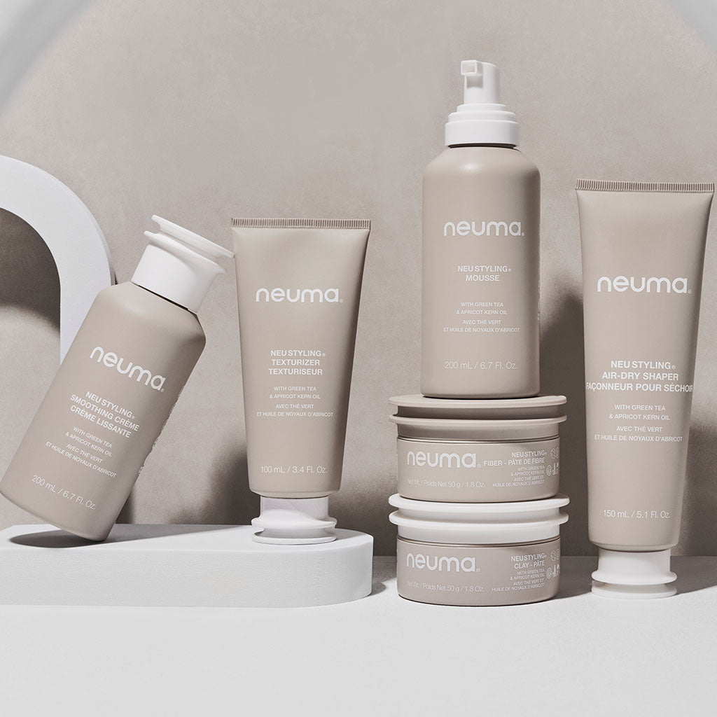 Neu Styling Fiber collection showcasing products for texturizing, thickening, and volume boost with a matte finish and lavender scent.