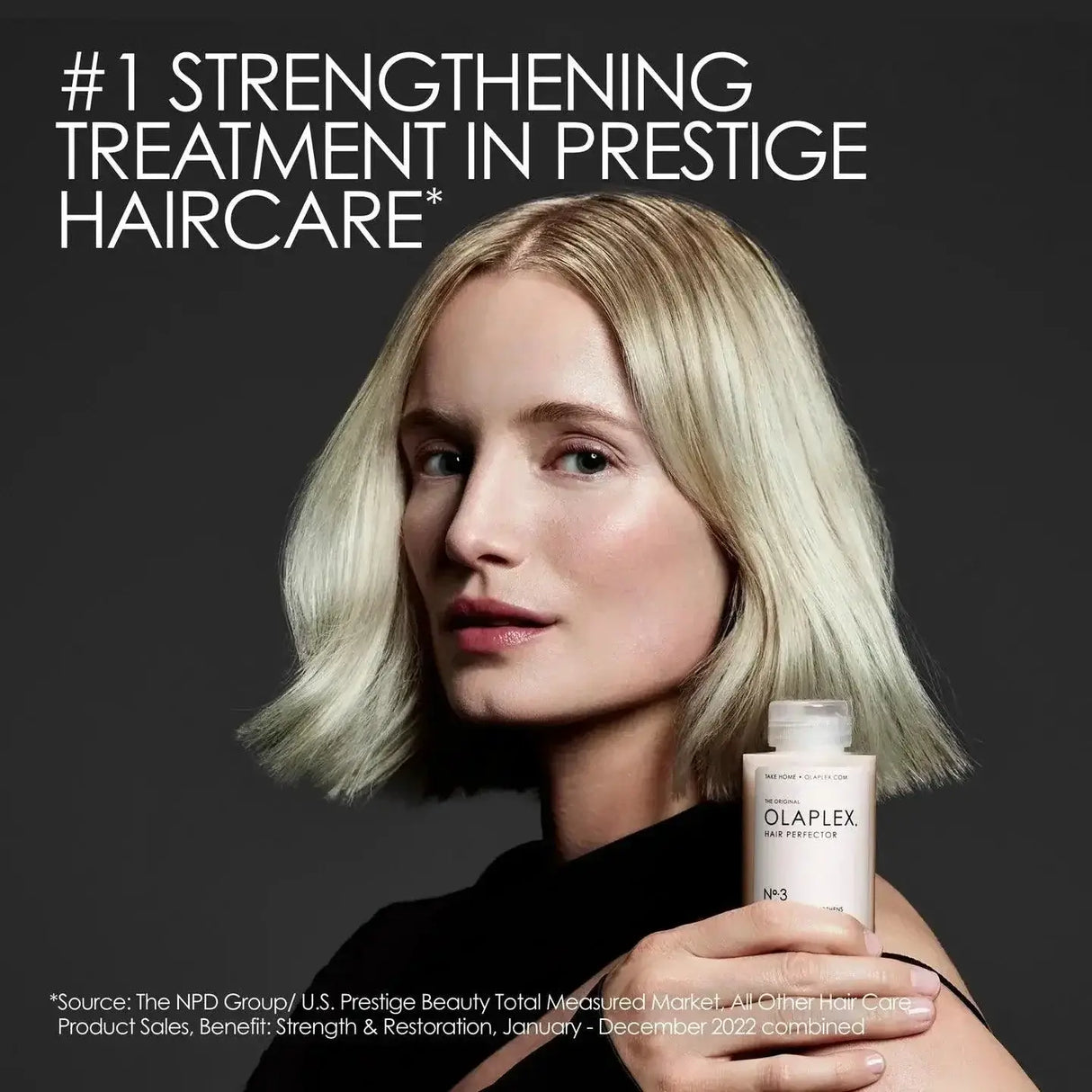 Woman holding Olaplex No.3 Hair Perfector, the top hair strengthening treatment according to NPD Group.