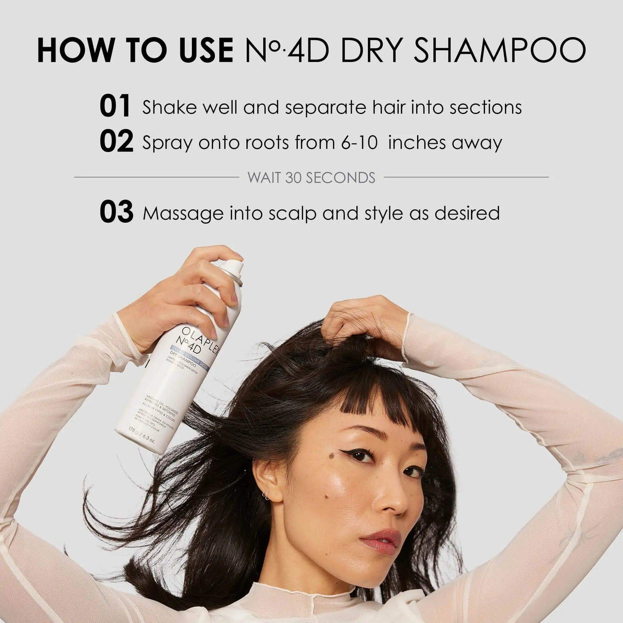 Woman using Olaplex No.4D Clean Volume Detox Dry Shampoo, demonstrating application steps: spray, wait, and massage for refreshed hair.
