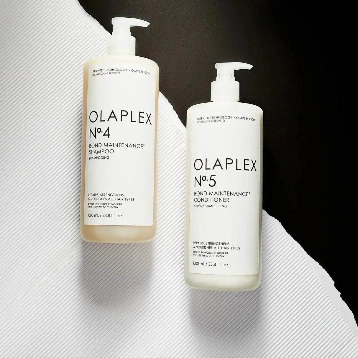 Olaplex Nº.5 Bond Maintenance Conditioner and Nº.4 Shampoo bottles on textured background, for repairing damaged hair.