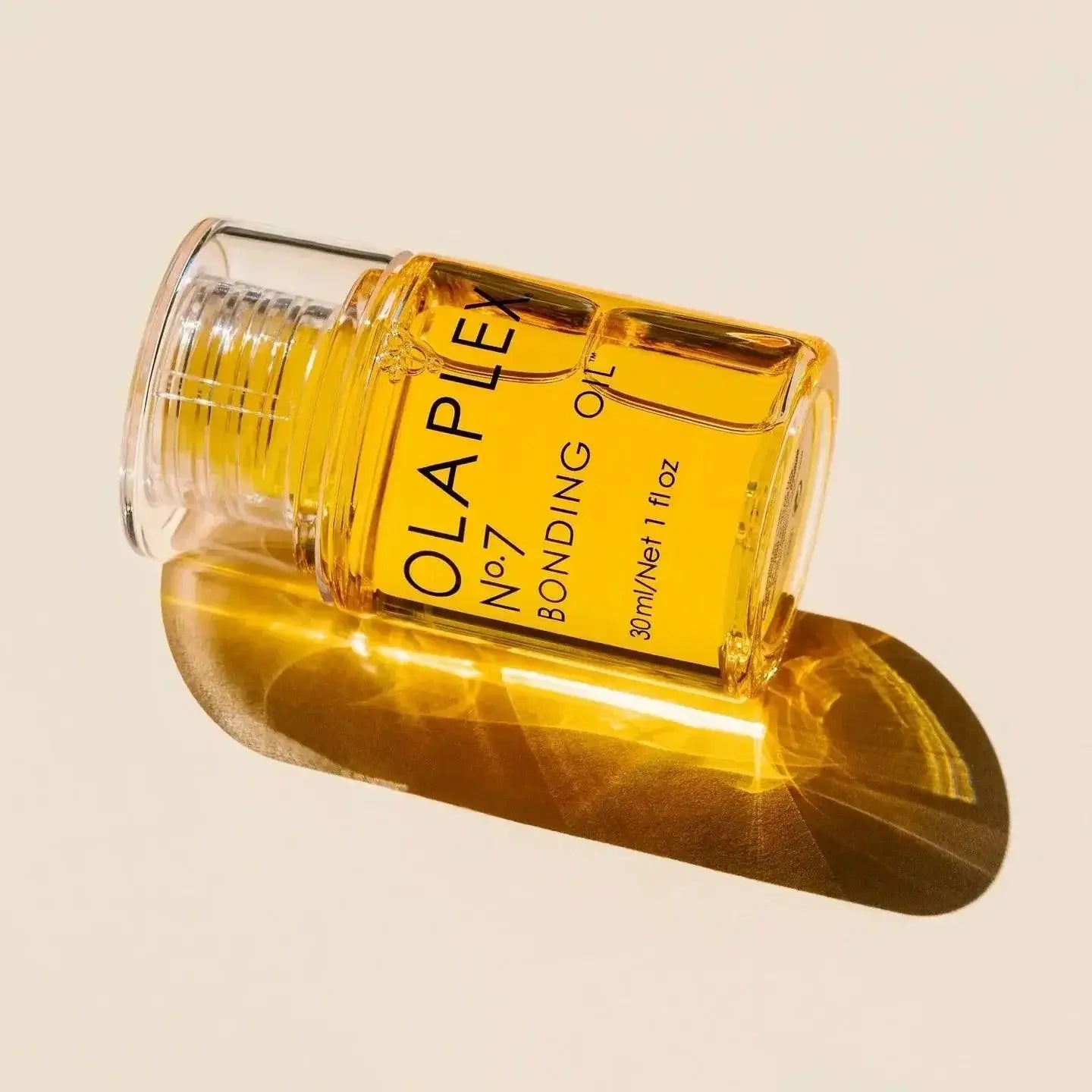 Olaplex Nº.7 Bonding Oil bottle on a light background, restorative and hydrating hair oil for damaged, dry hair, frizz, and split ends.