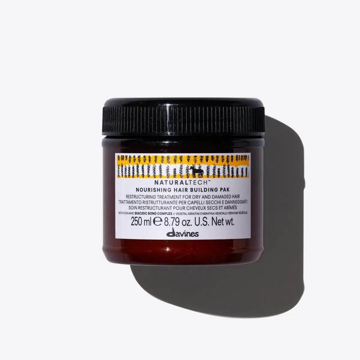 Nourishing Hair Building Pak, 250ml jar for repairing dry hair, promises soft, shiny results with natural ingredients.
