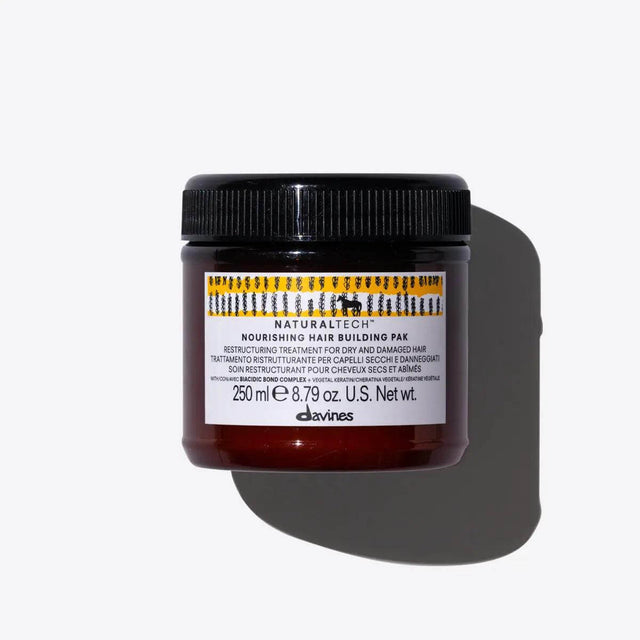 Nourishing Hair Building Pak, 250ml jar for repairing dry hair, promises soft, shiny results with natural ingredients.