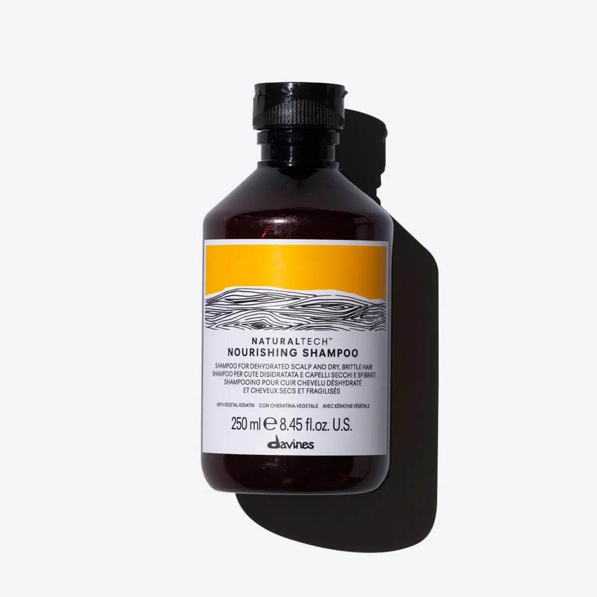 Alt Tag: Bottle of Davines Nourishing Shampoo for dehydrated scalp and dry hair, 250 ml, providing gentle cleansing and nourishment.