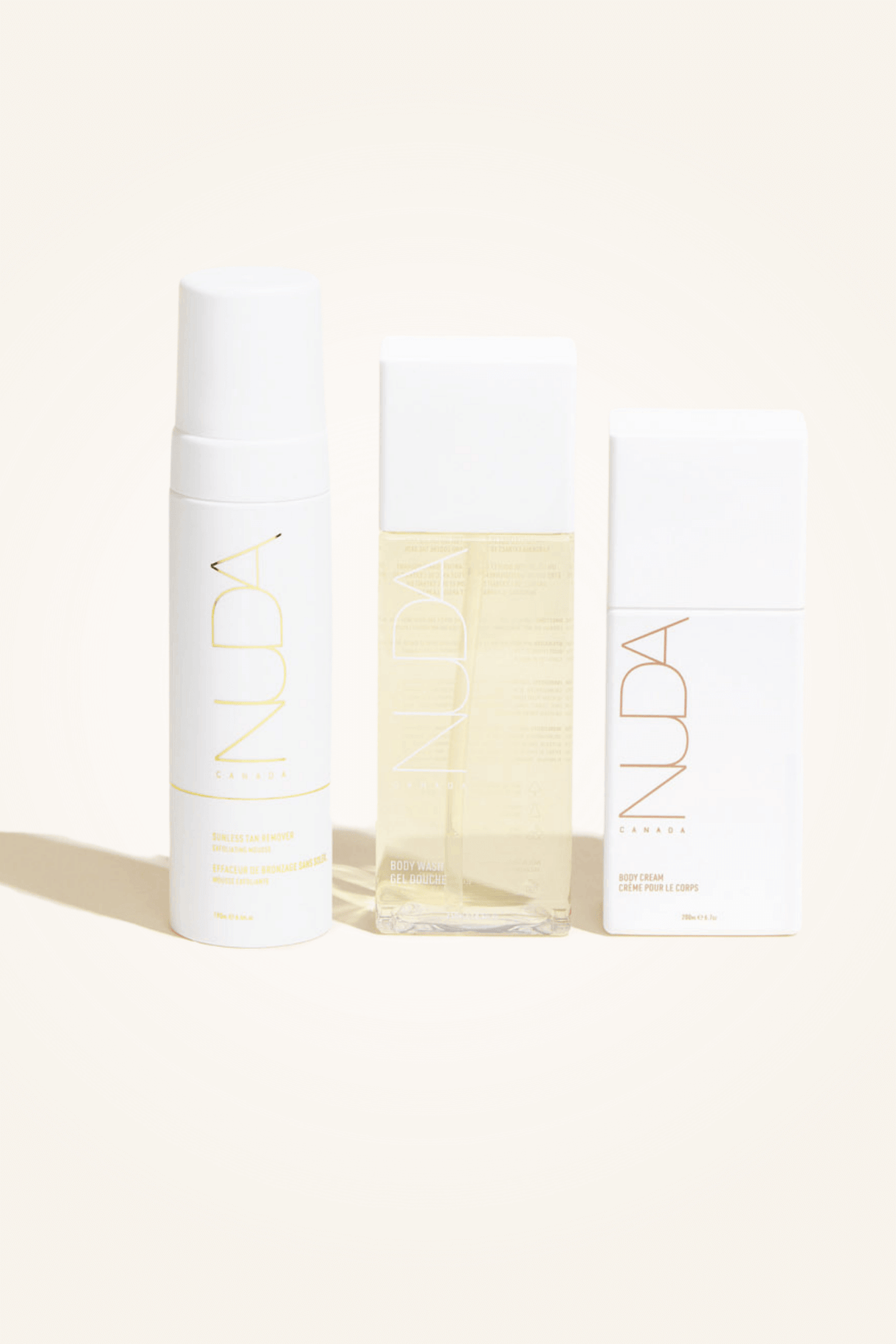 Body Essentials Trio set with exfoliant, body wash, and cream for sunless tanning preparation and skin hydration.