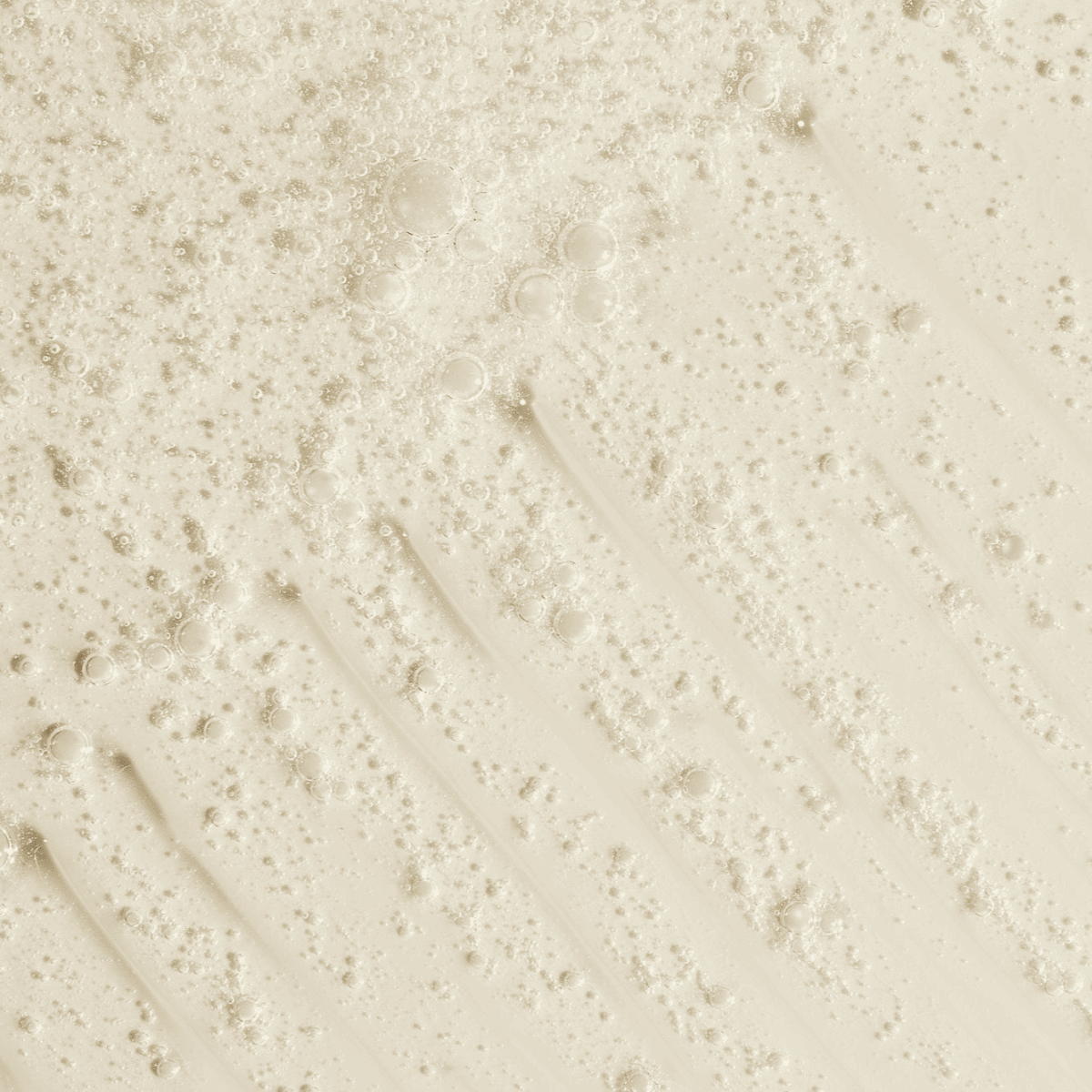 Close-up of a gentle daily-use body wash with visible bubbles, ideal for maintaining sunless tanning results.