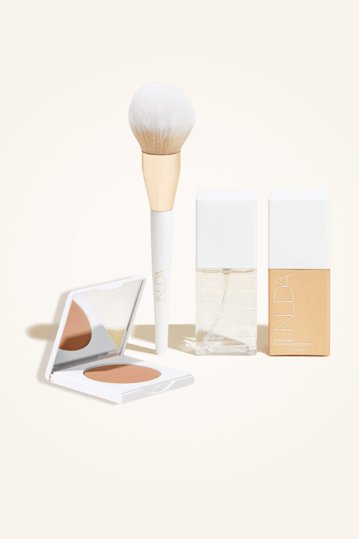 Deluxe Bronzed Kit featuring a facial self tanner, matte bronzing powder, brush, and bronzing glow drops for a radiant look.