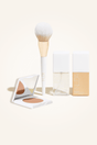 Deluxe Bronzed Kit featuring a facial self tanner, matte bronzing powder, brush, and bronzing glow drops for a radiant look.