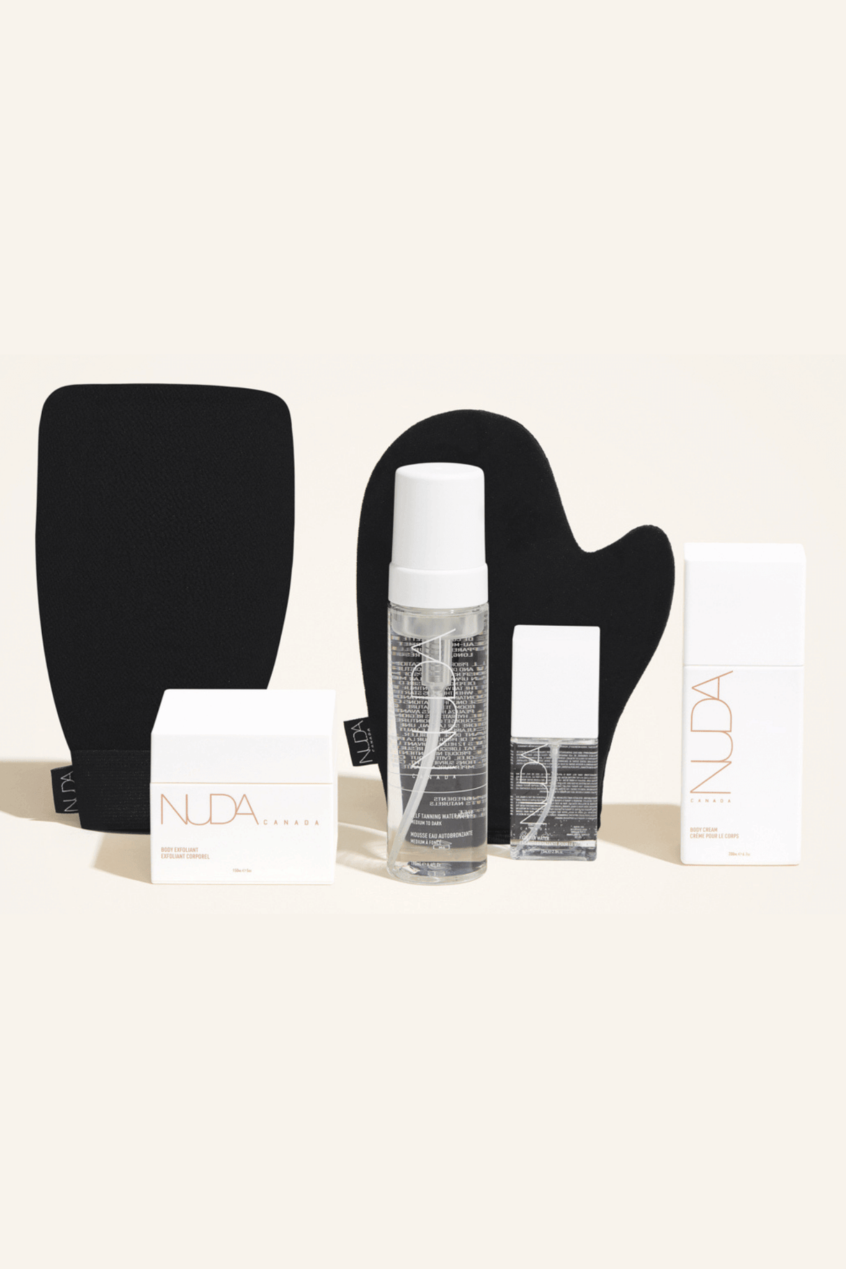 Deluxe Routine Kit with tanning mousse, face tanner, exfoliating mitt, and body cream for a sun-kissed glow and radiant complexion.