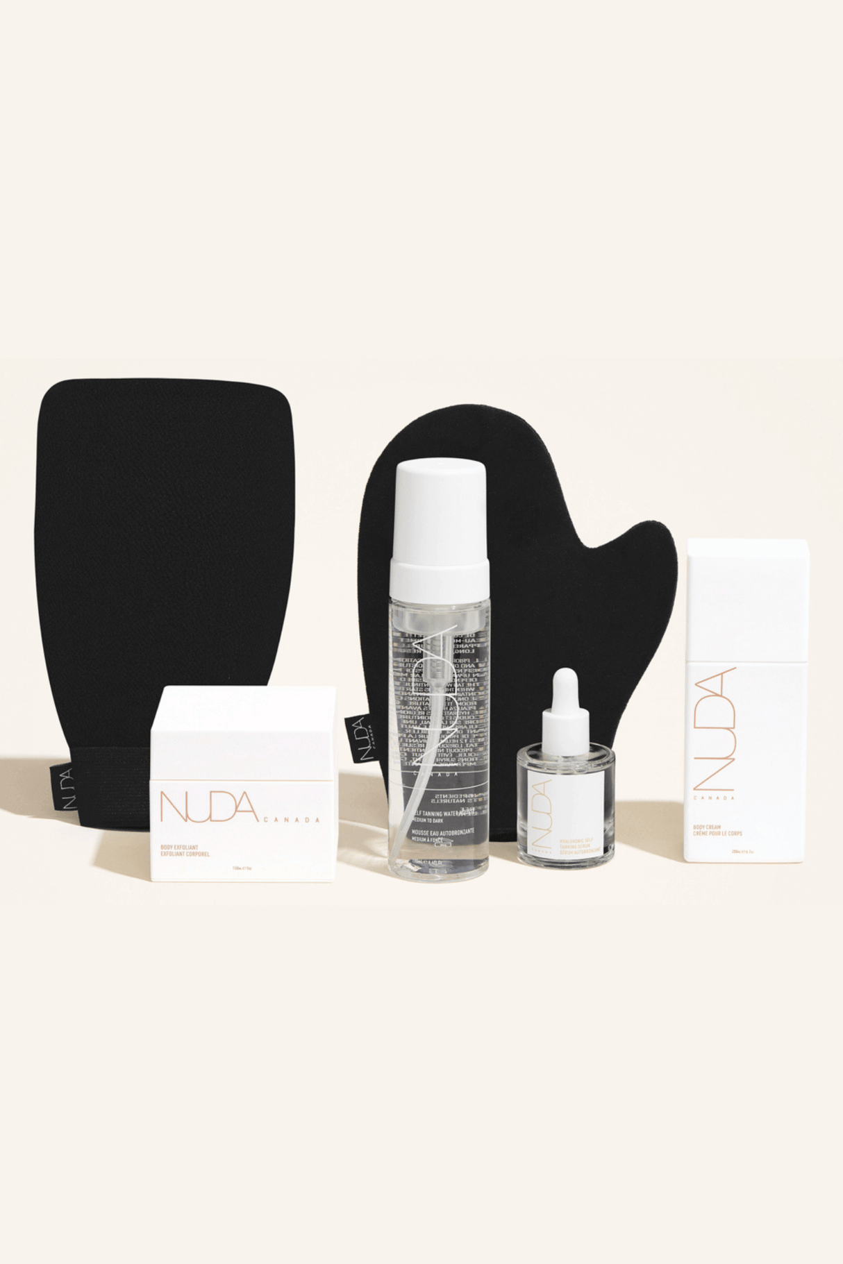 Deluxe Routine Kit featuring tanning mousse, face tanner, body cream, exfoliant, and mitts for a sun-kissed glow all year round.