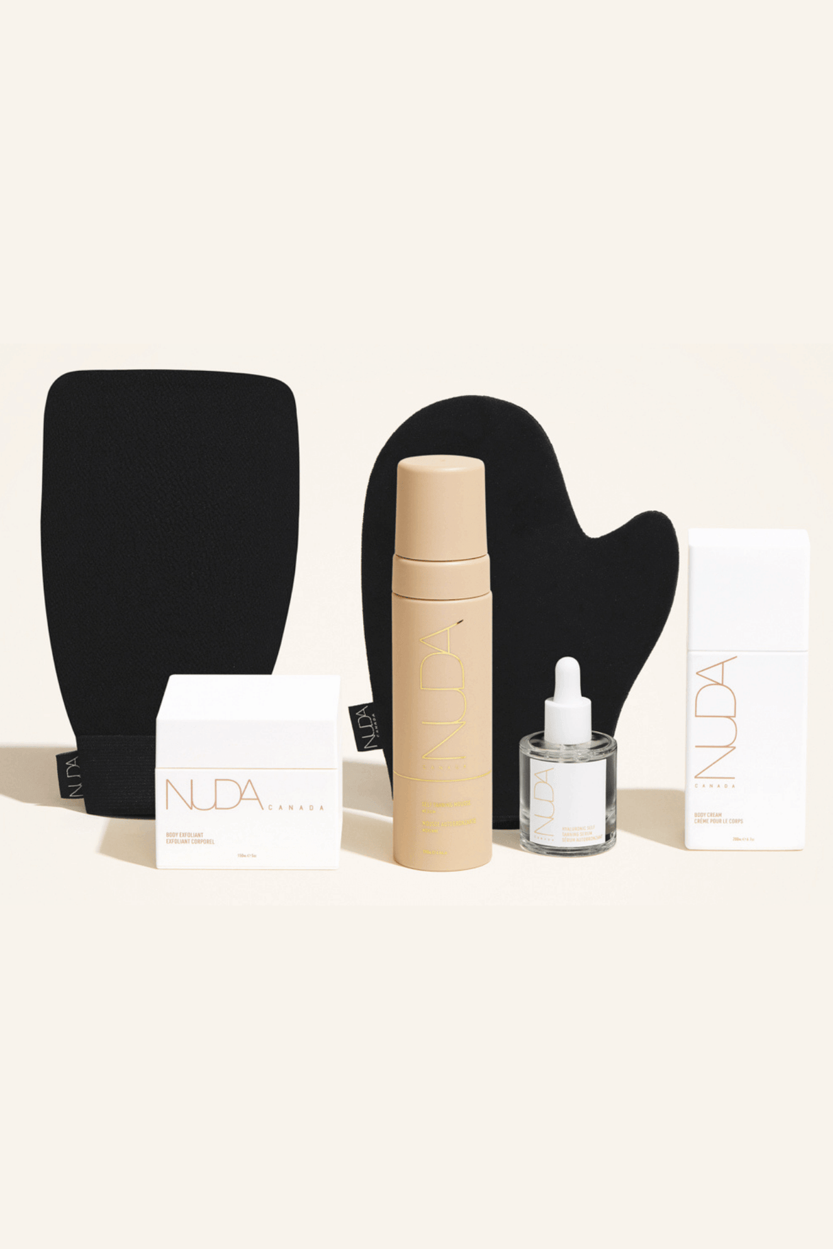 Deluxe Routine Kit with tanning mousse, mitts, face tanner, body exfoliant, and cream for sun-kissed glow.