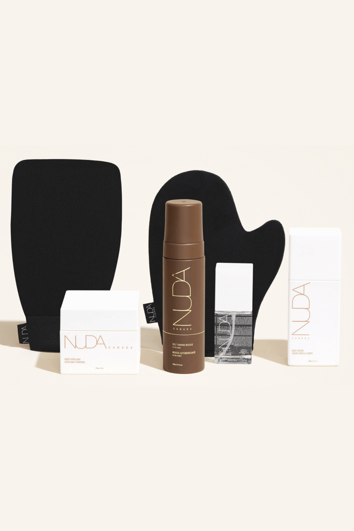 Deluxe Routine Kit with exfoliant, mitts, self tanning mousse, face tanner, and body cream for sun-kissed glow.