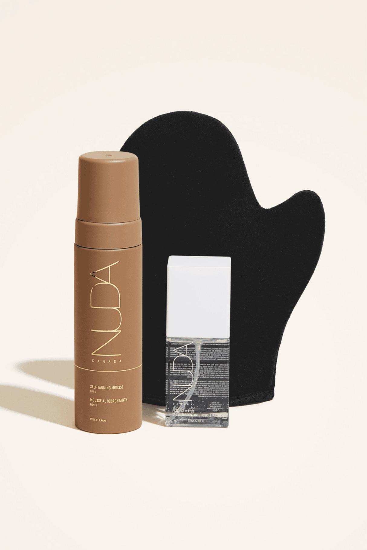 Glow Kit with self tanning mousse, mitt, and facial tanner for a sun-kissed, radiant complexion. Ideal for various skin tones.
