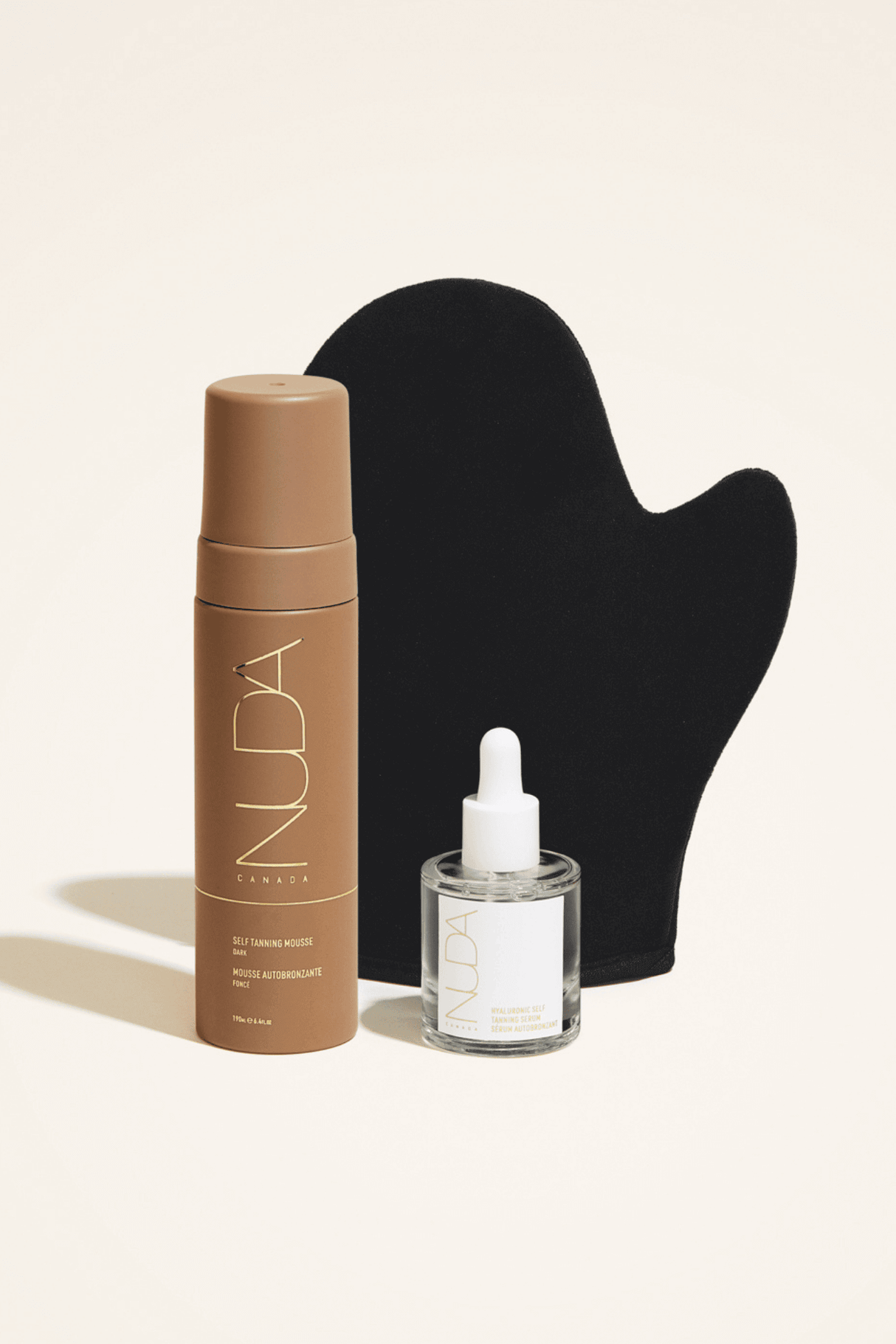 Glow Kit featuring self tanning mousse, facial tanner, and application mitt for a sun-kissed complexion.