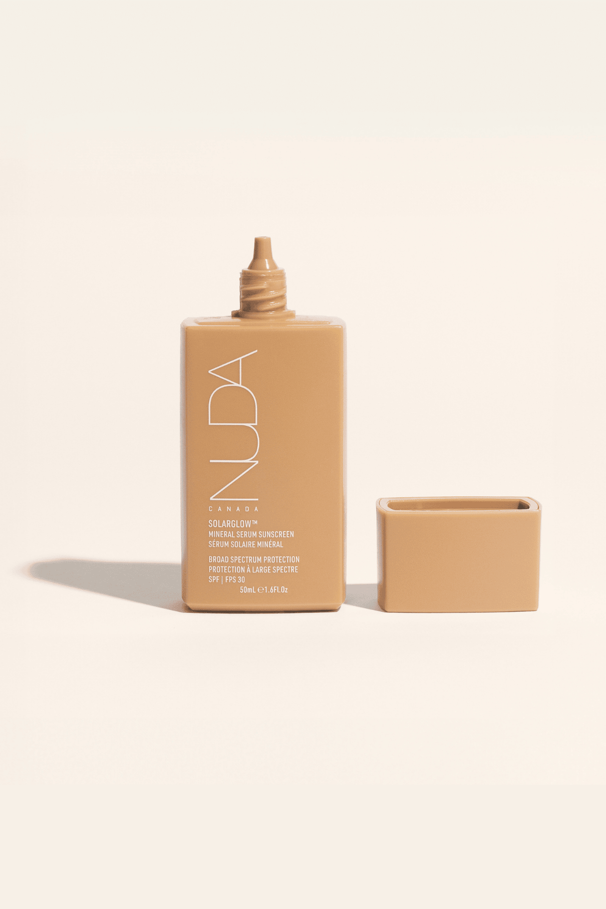 Solarglow™ Mineral Serum Sunscreen SPF 30 in a beige bottle, 50ml, with hydrating and protective formula including Vitamin E and Squalane.