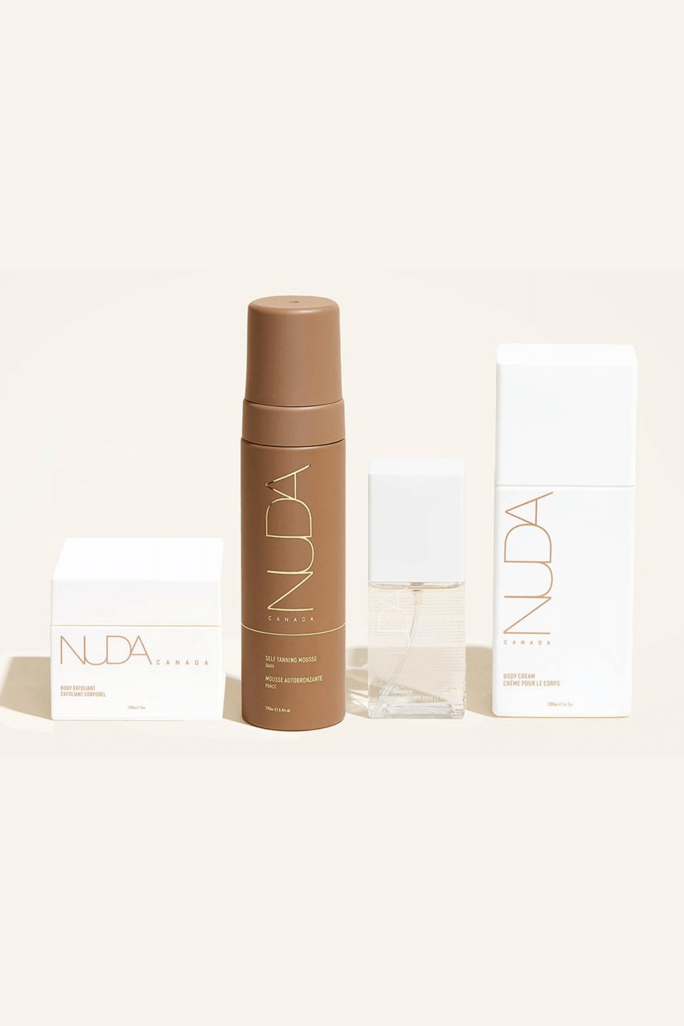 Nuda Routine Kit with self tanning mousse, body exfoliant, face tanner, and body cream for a year-round customizable glow