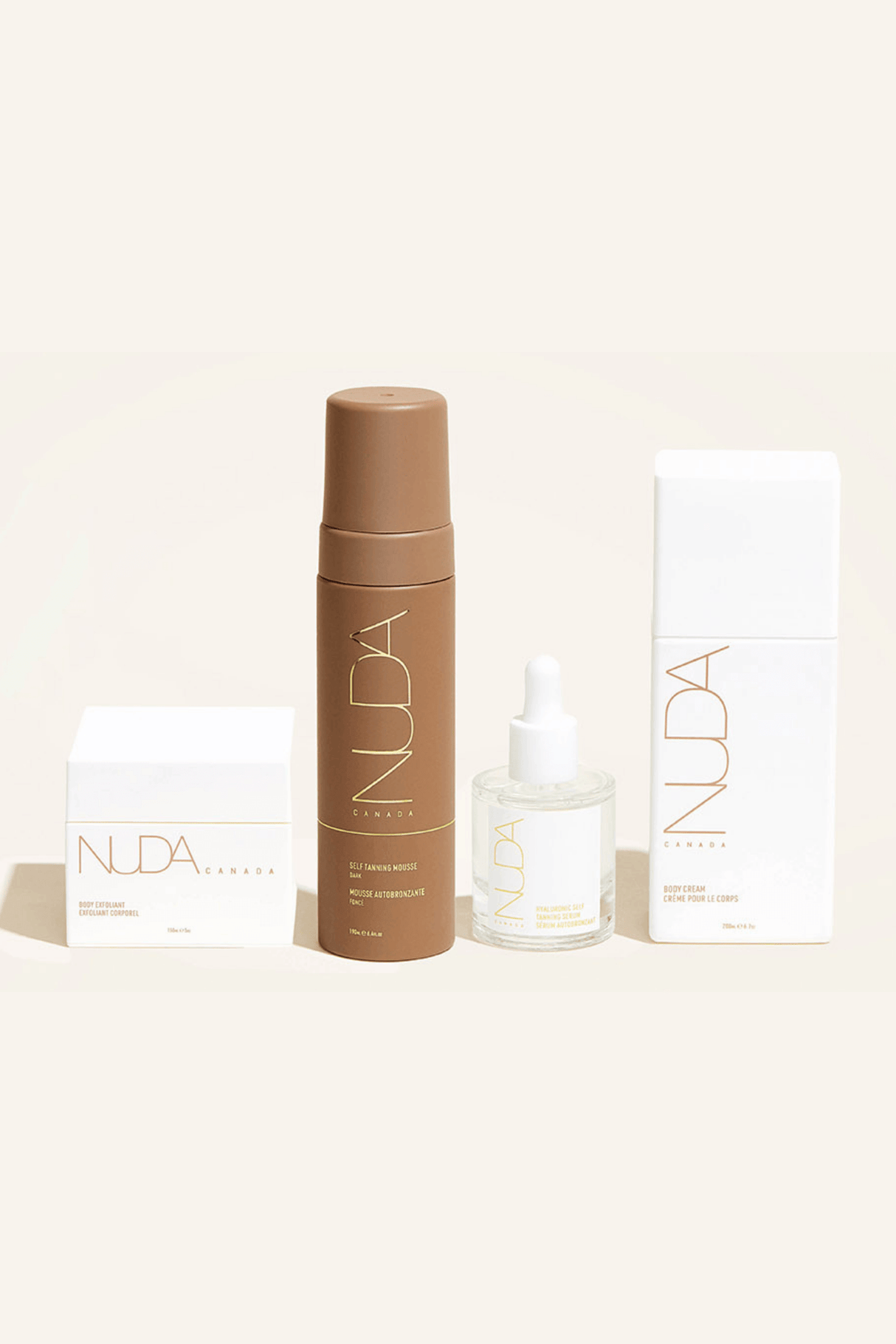 Nuda Routine Kit featuring body exfoliant, self tanning mousse, face tanner, and body cream for a radiant glow and prolonged tan.