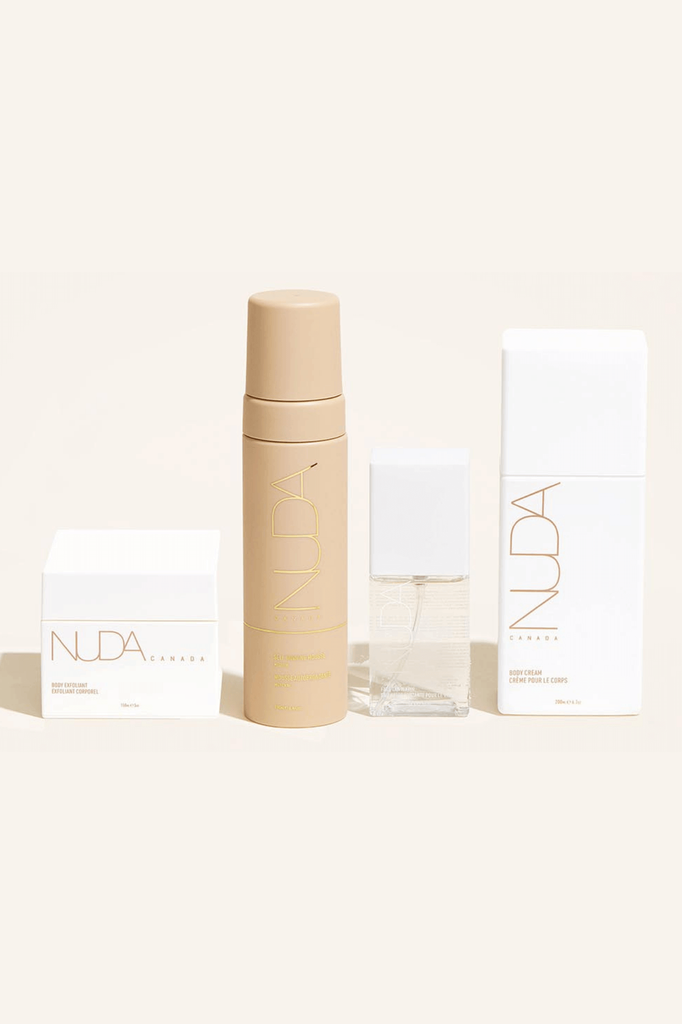 Nuda Routine Kit with body exfoliant, self tanning mousse, face tanner, and body cream for a radiant, year-round glow.