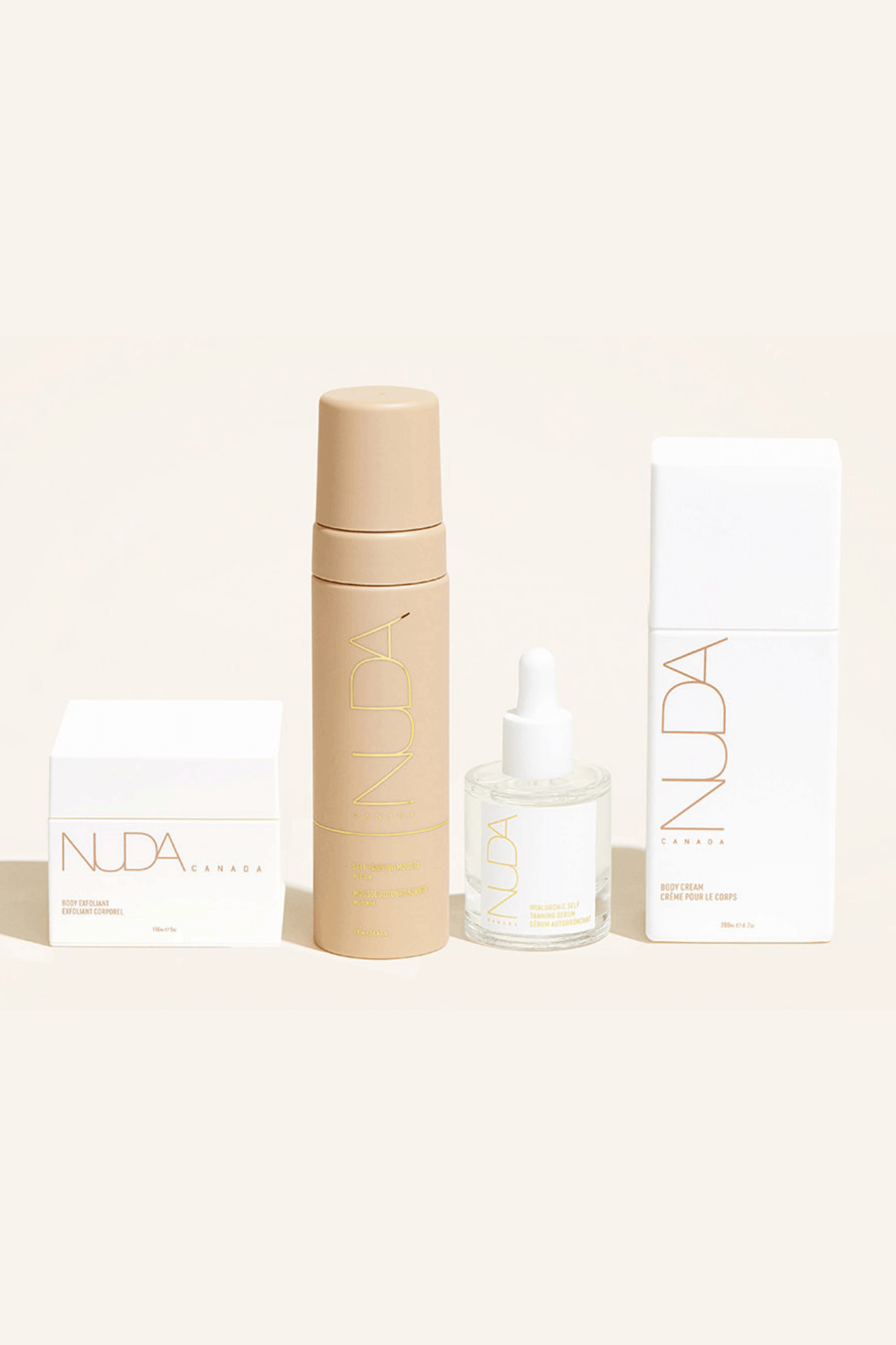 Nuda Routine Kit with body exfoliant, self tanning mousse, face tanner, and body cream for a year-round beautiful tan.