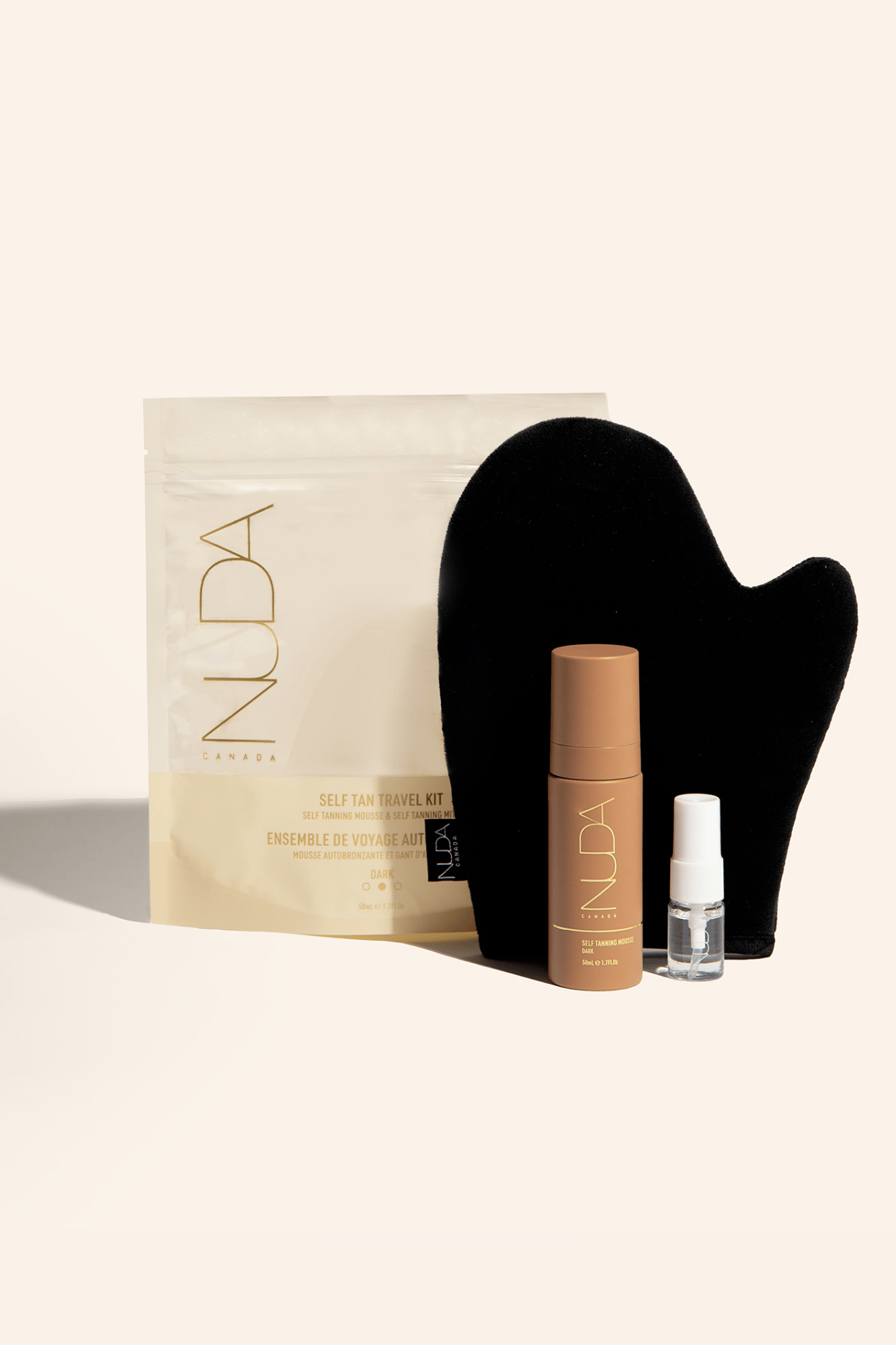 Self Tan Travel Kit with tanning mitt, spray, and moisturizer for sun-kissed skin on the go. Ideal for maintaining a radiant glow while traveling.
