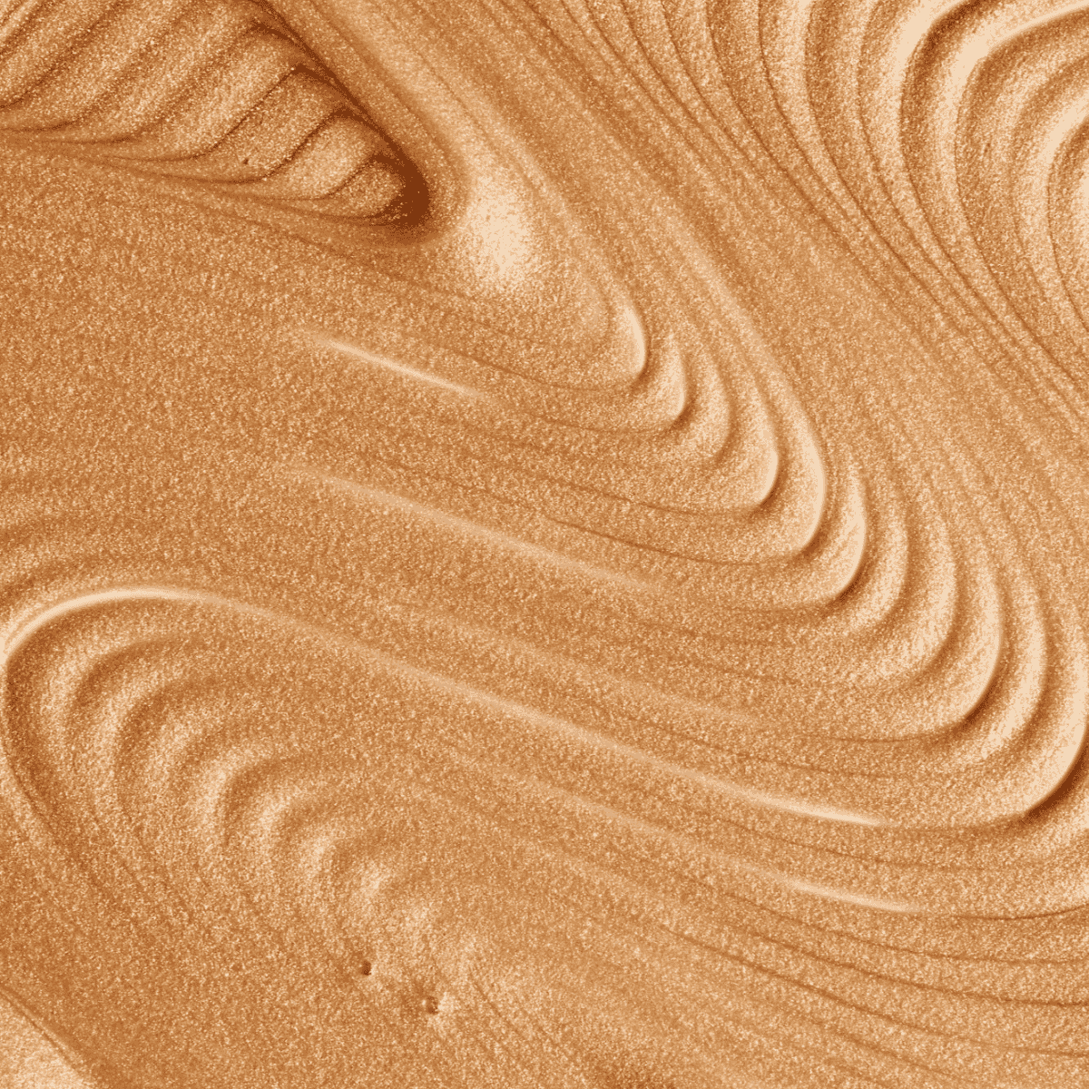 Luxurious gold body shimmer texture with radiant, silky finish, perfect for achieving an instant sun-kissed glow.