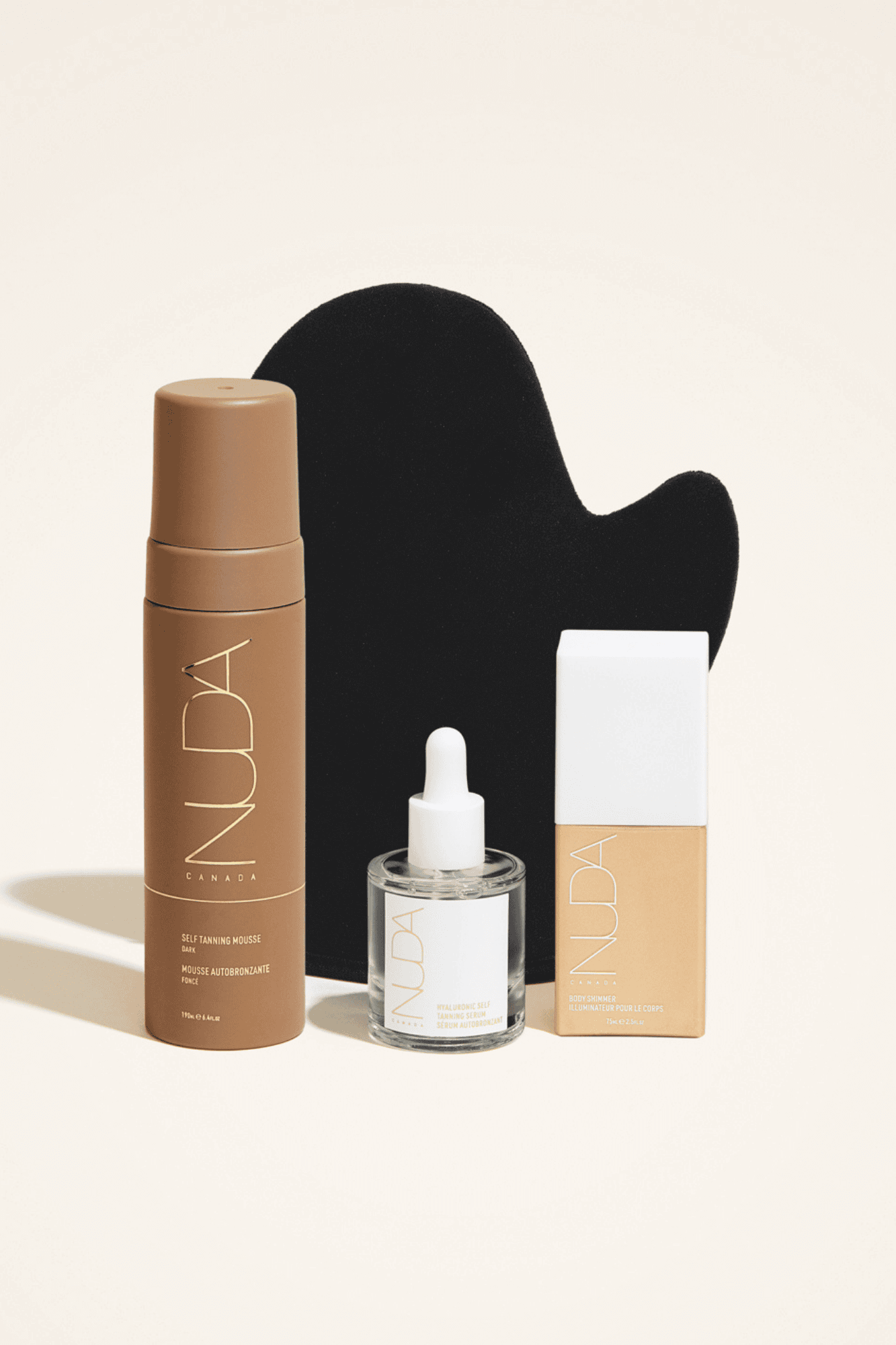 Ultimate Glow Kit featuring self tanning mousse, facial tanner, bronzing glow drops, and application mitt for a radiant complexion.