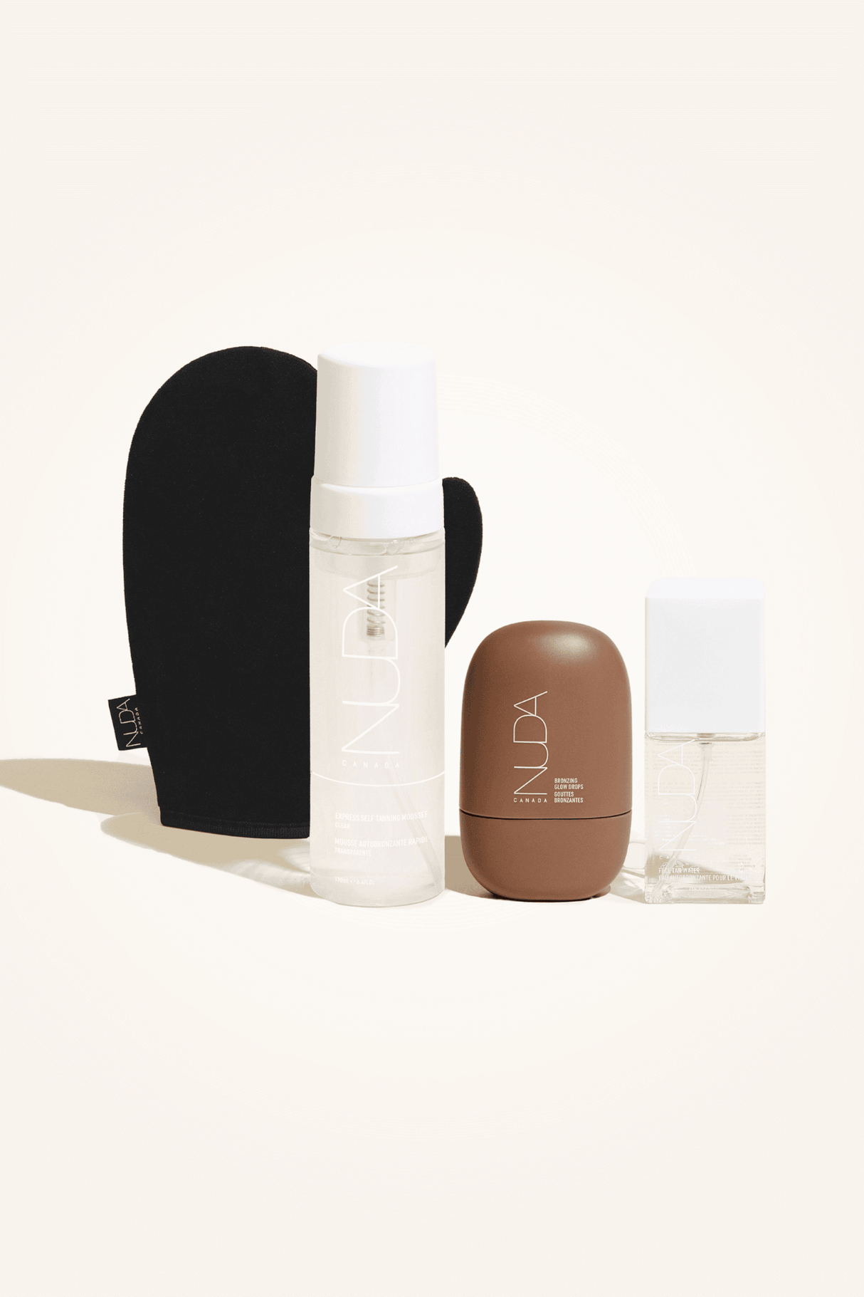 Ultimate Glow Kit with self-tanning mousse, mitt, facial tanner, and body shimmer for a customizable radiant glow.