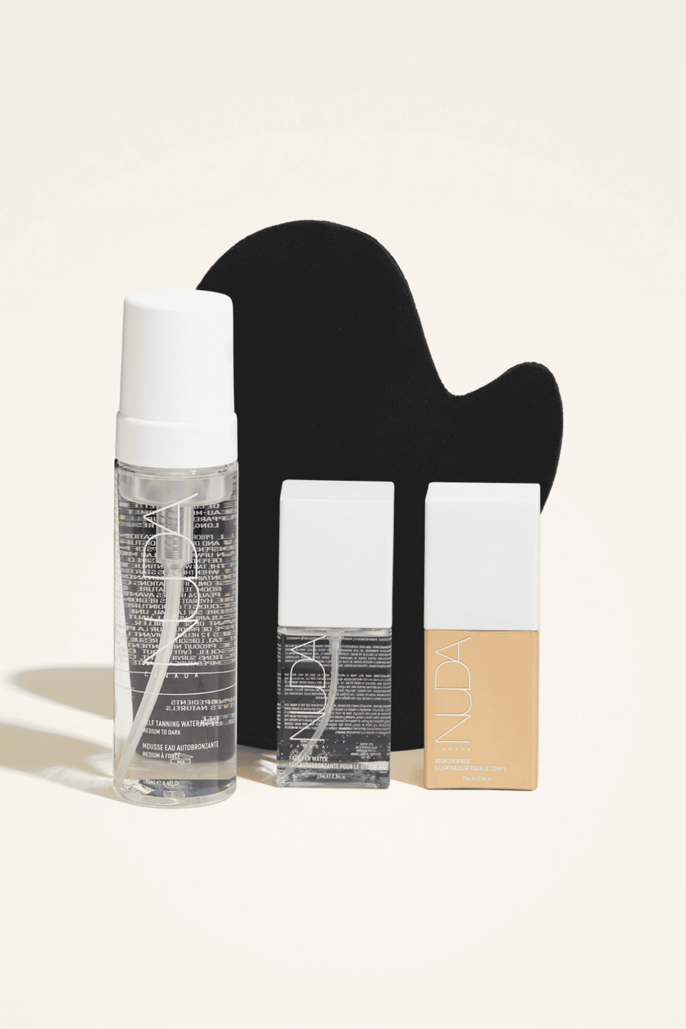 Ultimate Glow Kit featuring self tanning mousse, mitt, and facial tanners for a custom glow. Ideal for fair skin with added shimmer.