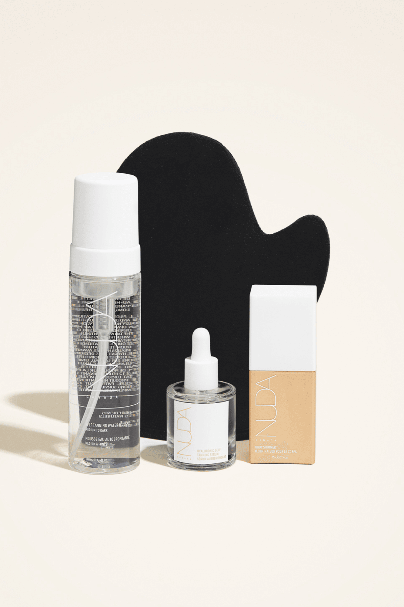 Ultimate Glow Kit featuring self tanning mousse, mitt, facial tanner, and bronzing glow drops for a radiant complexion.