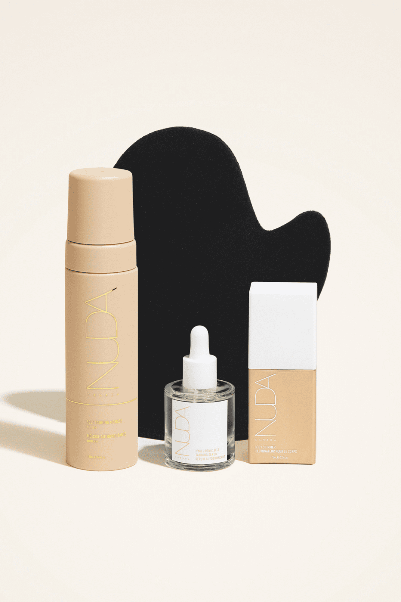 Ultimate Glow Kit featuring self tanning mousse, mitt, facial tanner, and bronzing glow drops for a radiant complexion.