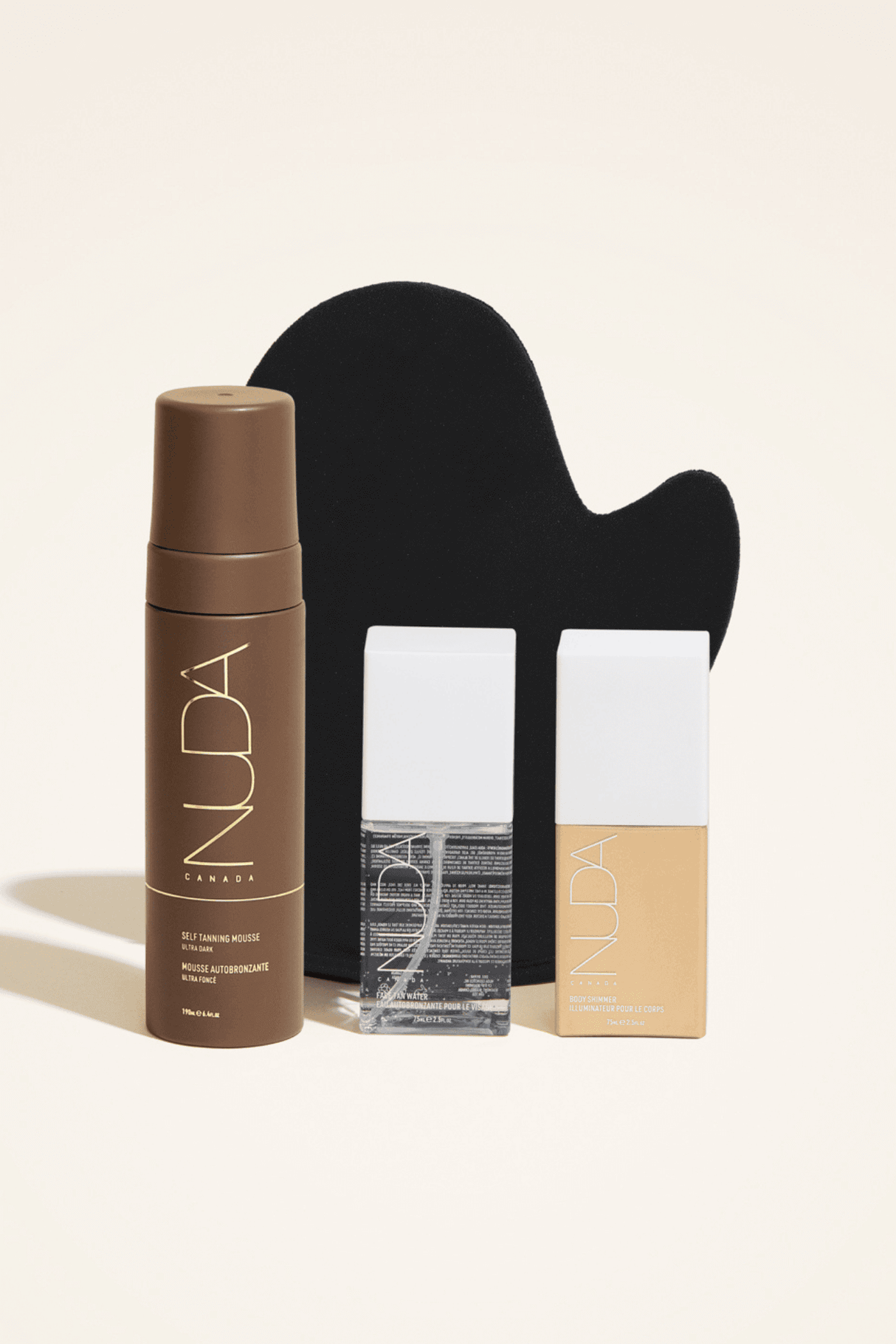 Ultimate Glow Kit with tanning mousse, mitt, and bronzing glow drops for a radiant, customized self-tanning experience.