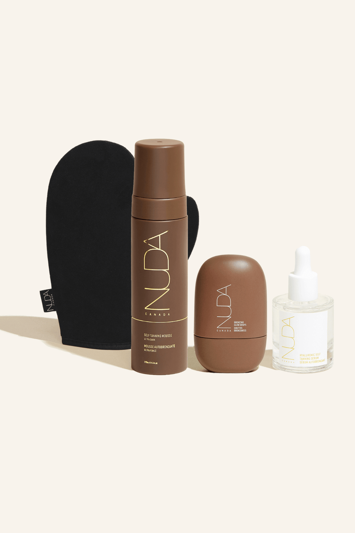 Ultimate Glow Kit with tanning mousse, mitt, facial tanner, and bronzing drops for a customizable sun-kissed skin tone.