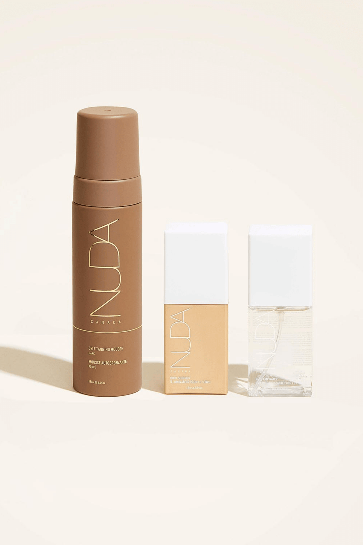 Ultimate Glow Trio self-tanning set with mousse, facial tanner, and bronzing drops for a radiant, customizable skin tone.