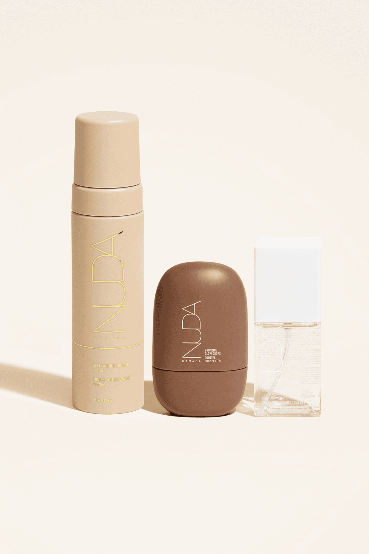 Ultimate Glow Trio self-tanning set; includes tanning mousse, facial tanner, and body shimmer for a radiant bronze glow.