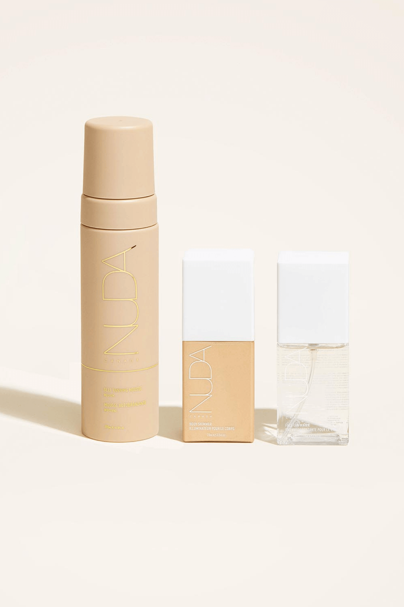 Ultimate Glow Trio self-tanning set with mousse, facial tanners, and body shimmer for a radiant bronzed look.