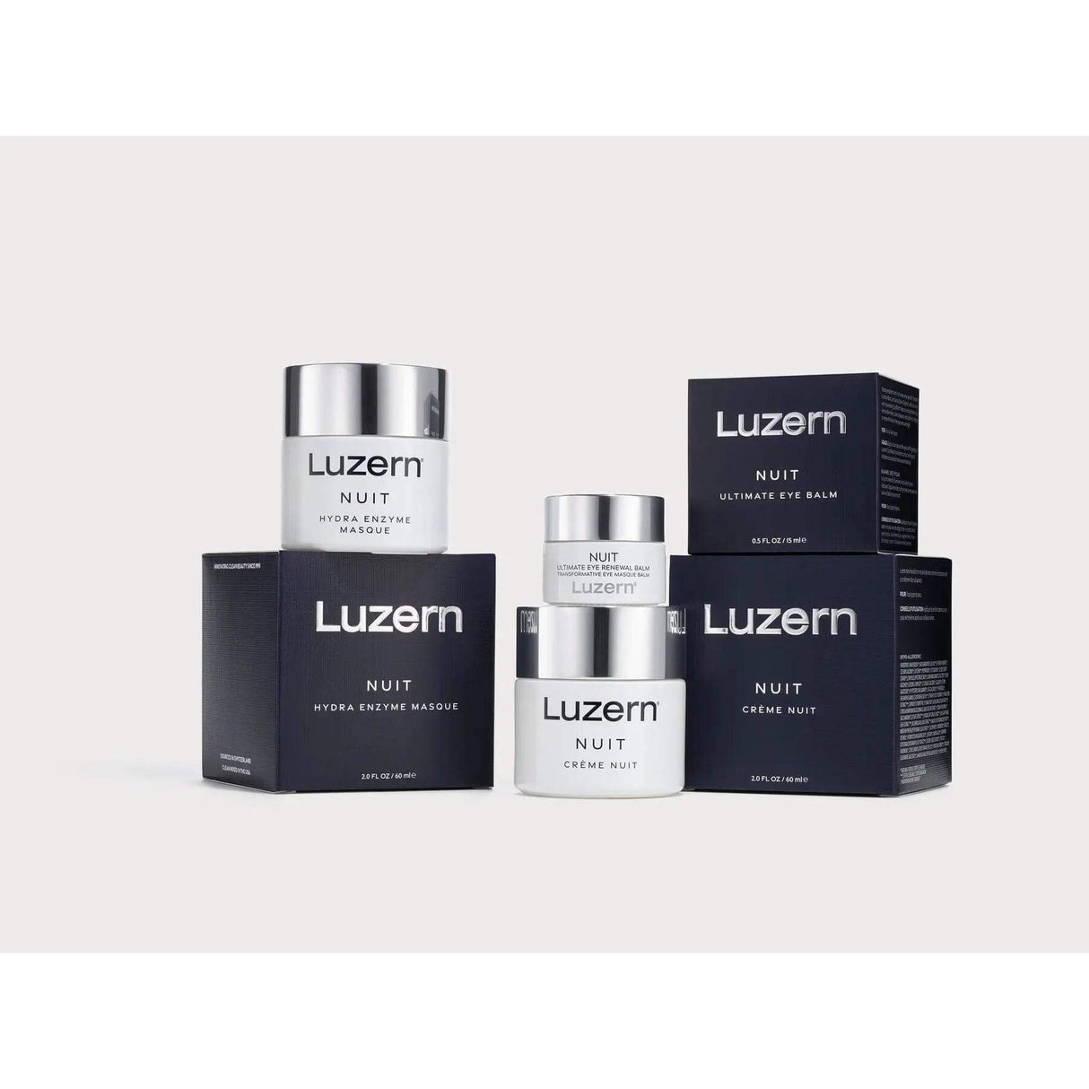 Nuit Hydra Enzyme Masque and other Luzern skincare products on display, ideal for addressing fine lines, wrinkles, and discoloration.