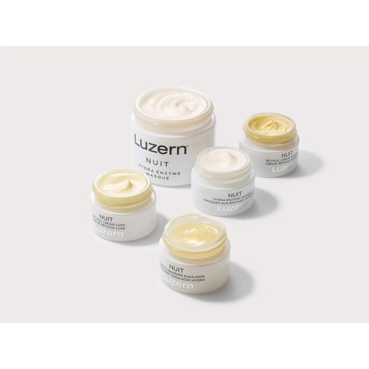 Array of Nuit Hydra Enzyme Masque jars displaying luxurious skincare creams for deep hydration and skin enhancement.