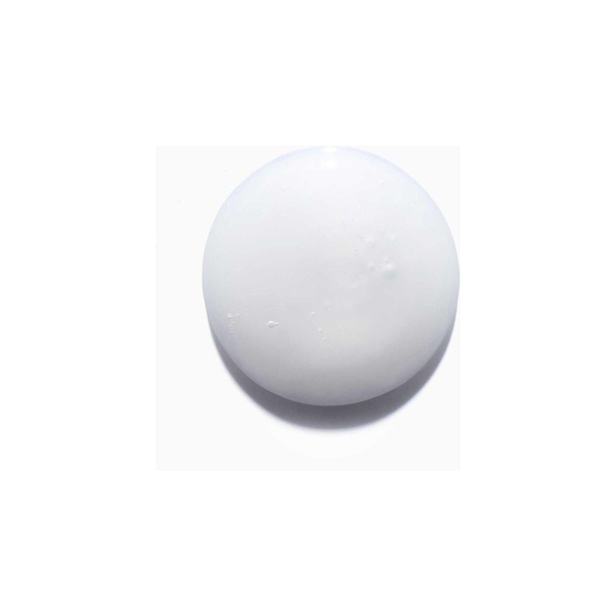 Close-up of Nutritive Bain Satin Riche Shampoo texture; white, creamy consistency for nourishing very dry hair.