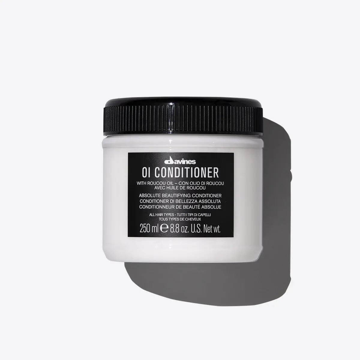 OI Conditioner jar enriched with Roucou Oil for soft, voluminous hair. Luxurious, creamy formula suitable for all hair types.
