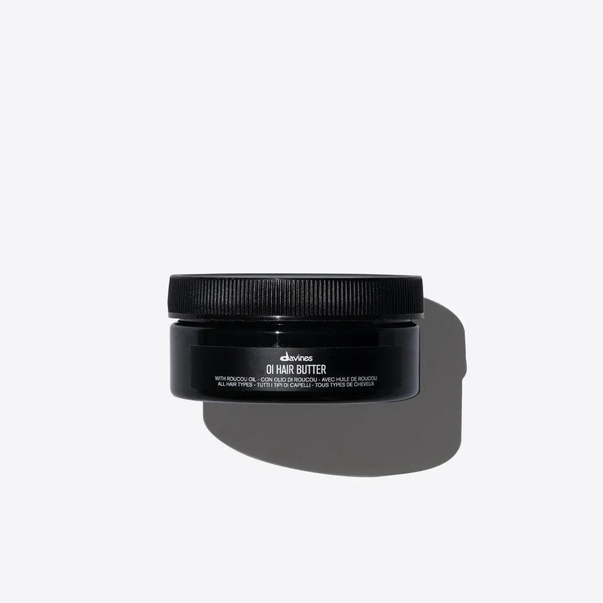 Top view of Oi Hair Butter container with antioxidant properties, offering frizz control and shine for nourished hair.