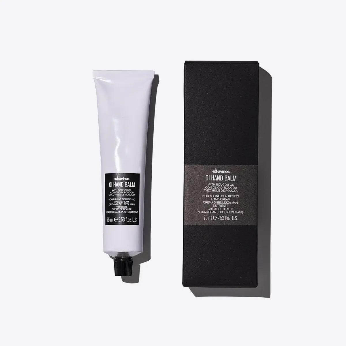 Oi Hand Balm tube and box, nourishing hand cream with antioxidants for all skin types, provides long-lasting moisture and protection.